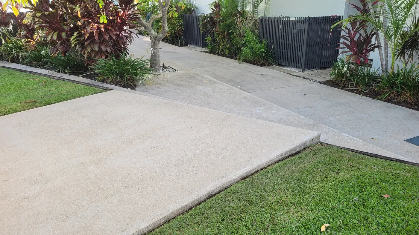 Concrete path after pressure cleaning — restored to clean